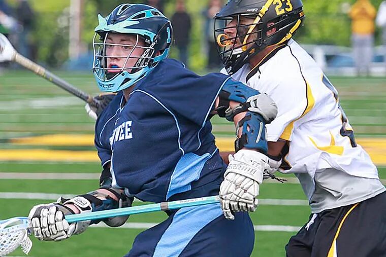 Shawnee High School's David Smith (left) and Moorestown High School's Anthony Labetti try  to get a ball during the second period. Shawnee High School won over 4-3 from Moorestown High School at overtime at Wesley Bishop Field, Moorestown, NJ. (Akira Suwa/  Staff Photographer)