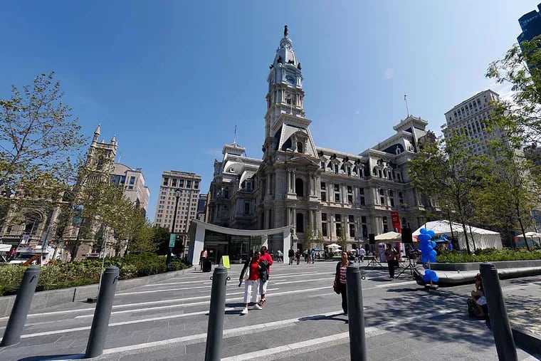 People walk through the newly opened Dilworth Park, Thursday, Sept. 4, 2014, at City Hall in Philadelphia.  (AP Photo/Matt Rourke)
