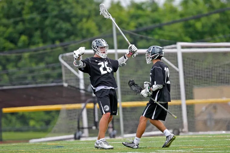 Strath Haven's Jeffery Conner (left) celebrates with Nicky Palermo after conner scored against Springfield during of a PIAA Class 2A boys lacrosse Quarterfinal game,Saturday June 2, 2018, in West Chester, PA. Strath Haven won 12-9. 