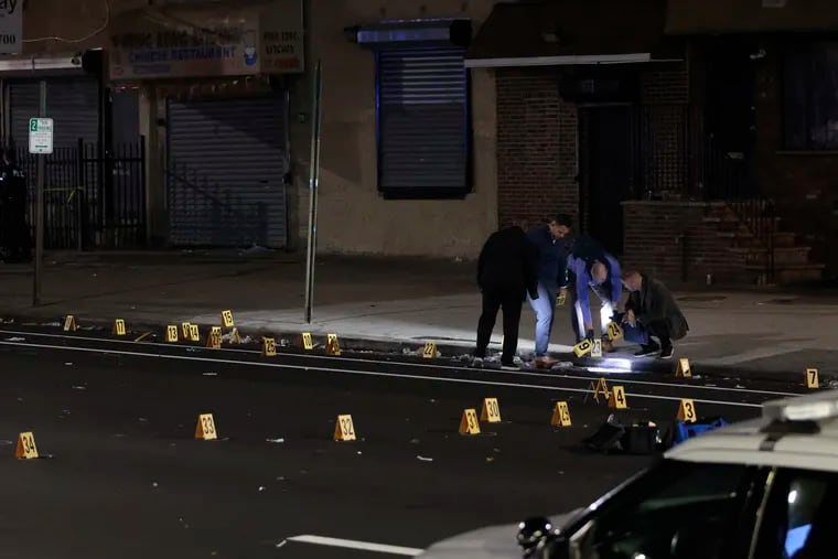 Philadelphia Police process the crime scene where several people were injured in a shooting in Kensington late Saturday.