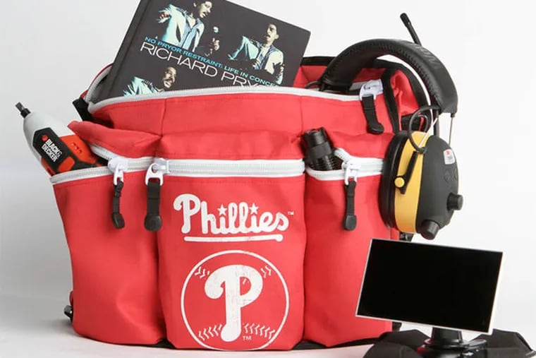 STEPHANIE AARONSON / STAFF PHOTOGRAPHER A whole kit-load of stuff for dad on his day, handily held by the Diaper Dude Phillies Bag.