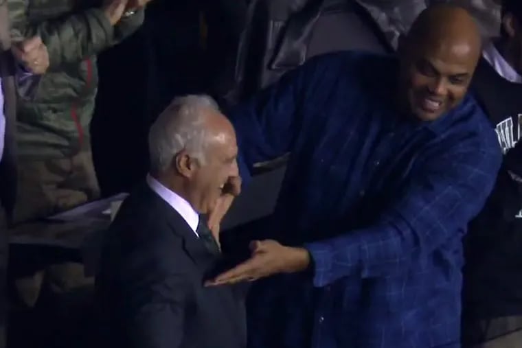 NBA Hall of Famer and former Sixers great Charles Barkley hugs Eagles owner Jeff Lurie during the NFC Championship game in Lincoln Financial Field Sunday night.