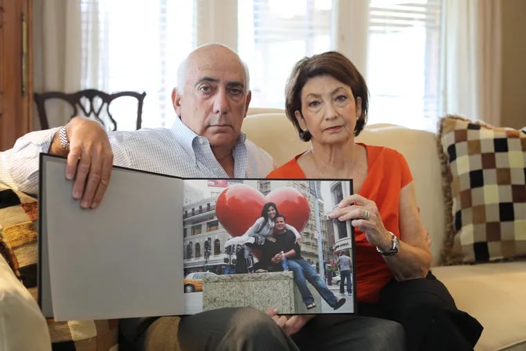 Joshua & Sandra Greenberg hold a scrapbook of their daughter in their Harrisburg home. In 2011, Philadelphia elementary school teacher Ellen Rae Greenberg was found dead of stab wounds in her apartment. The Philadelphia Medical Examiner's Office initially ruled her death a homicide, then changed their ruling to suicide one month later, Friday July 13, 2017.  DAVID SWANSON / Staff Photographer .