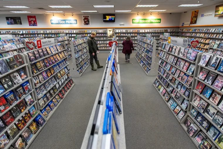 Shoppers look for videos at Family Video in Warren, Pa. The store was full on a Friday night and is one location of the longest-standing video rental chain in the U.S.