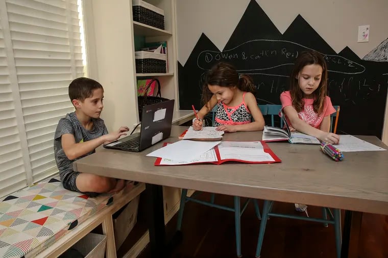 What was once a breakfast nook became a classroom for virtual learning. Now that they've returned to school, Owen, 8, and his sisters Caitlin, 6, and Courtney, 8, do their homework there.