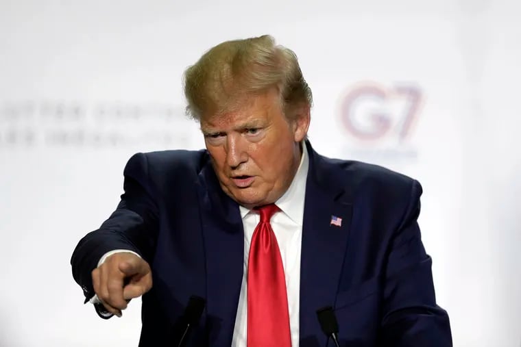 President Donald Trump gesturing as he speaks during a press conference Monday, the third and final day of the G-7 summit in Biarritz, France.