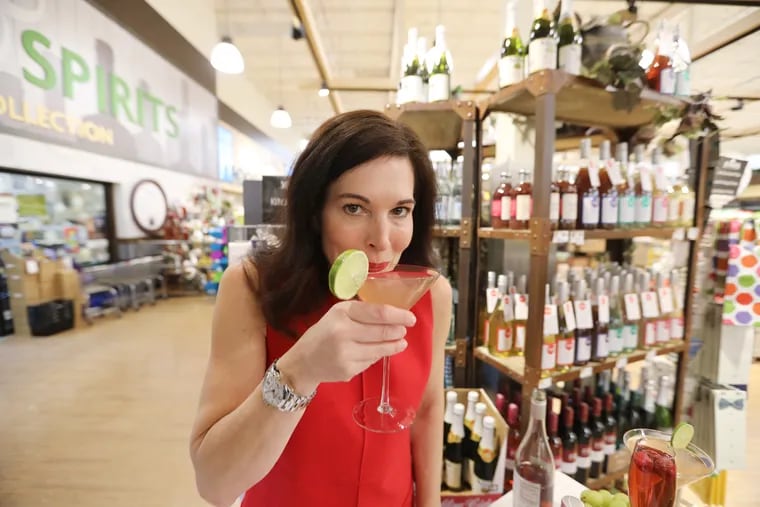 Laura Taylor, founder of Mingle Mocktails, with her alcohol-free libations at McCaffrey's Market in Blue Bell.