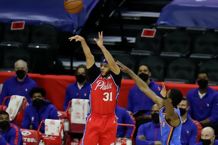 Sixers guard Seth Curry shoots a three-point basket against Oklahoma City.