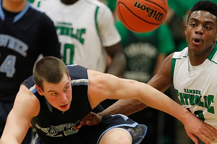 Shawnee's Sam Portner tries for a steal on Camden Catholic's Courtney Cubbage. (Ron Cortes/Staff Photographer)