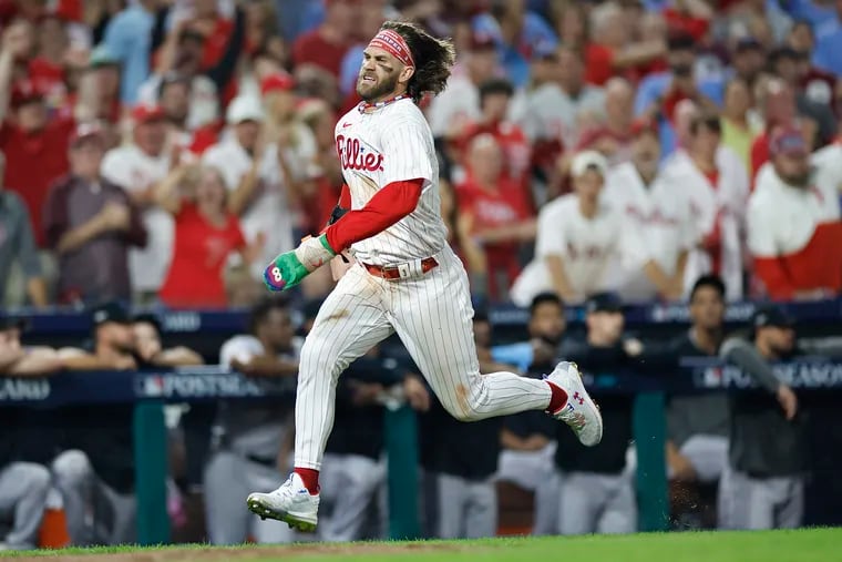 Bryce Harper runs home after missing a stop sign by third-base coach Dusty Wathan in Game 1 on Tuesday.