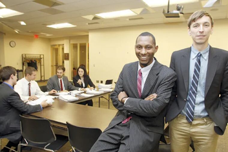 Expungement Project leaders Ryan Hancock (right) and Mike Lee at a meeting with lawyers. (Yong Kim / Staff Photographer)