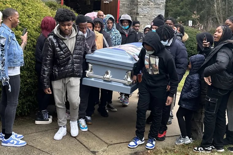Teenagers carry Tyshaun Wells' casket at his funeral in January. Wells, 16, was waiting for the subway at the City Hall SEPTA station when gunfire broke out on the platform. Earlier that evening, Wells had been at the Level Up after-school program.