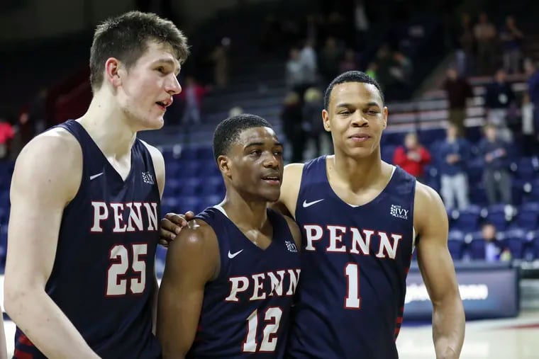 Penn seniors AJ Brodeur (25), Devon Goodman (12) and Ray Jerome (1) walk off the Palestra floor after beating Columbia in what turned out to be the final game for the three.