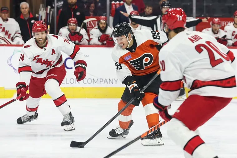 Flyers right wing Cam Atkinson skates with the puck during the first period against the Carolina Hurricanes on Monday.
