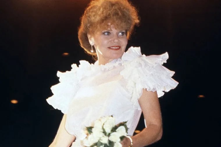 Actress Brennan Eileen models clothes at a gala in Hollywood where stars wore original costumes in honor of the designers, Oct. 1982. (AP Photo/Doug Pizac)