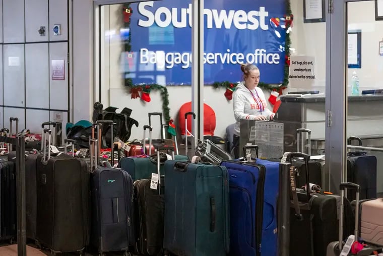 Unclaimed luggage piles up at the Southwest Airlines baggage service office in Philadelphia International Airport.