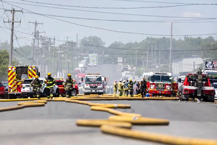 Philadelphia Firefighters and EMS are at the scene of the salvage yard fire along 61st Street   in Philadelphia, Pa., on Friday, May 26, 2023. 