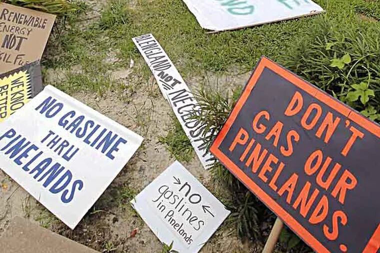 Protest signs lay at the NJ Pinelands Commission office ground while hearing is going on inside. July 26, 2013( AKIRA SUWA  /  Staff Photographer )