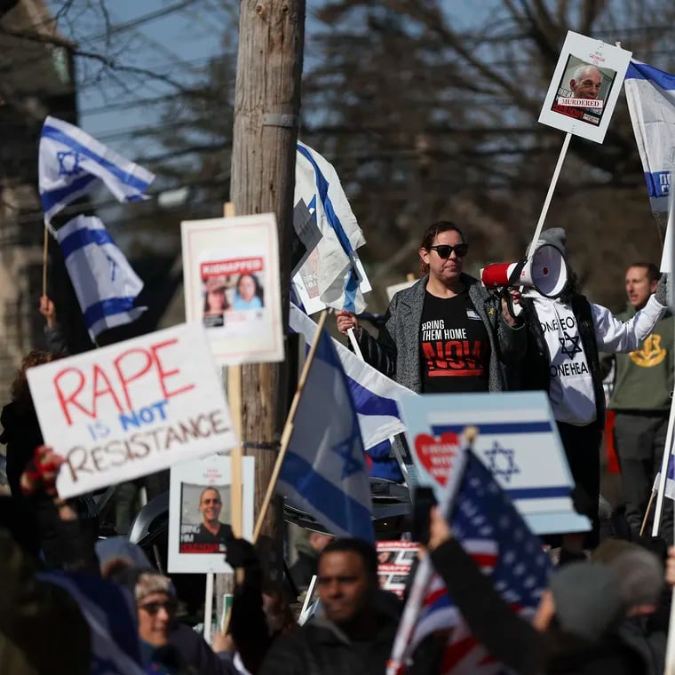 A group of protesters in support of Israel stand on Montgomery Ave. as protesters in support of Palestine, mainly from Haverford College, march by in Ardmore, Pa. on Saturday, Feb. 24, 2024.