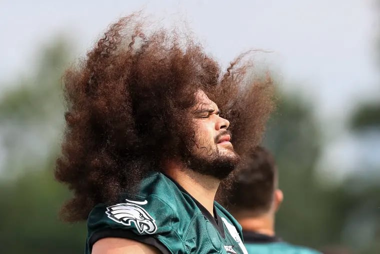 Philadelphia Eagles offensive guard Isaac Seumalo (56) flips his hair during Philadelphia Eagles training camp at the NovaCare Complex in Philadelphia, Pa. on Tuesday, August 10, 2021.