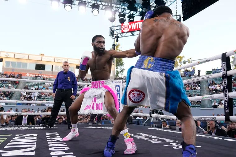Jaron Ennis (left) throws a punch at Custio Clayton during their welterweight boxing bout Saturday, May 14, 2022, in Carson, Calif.