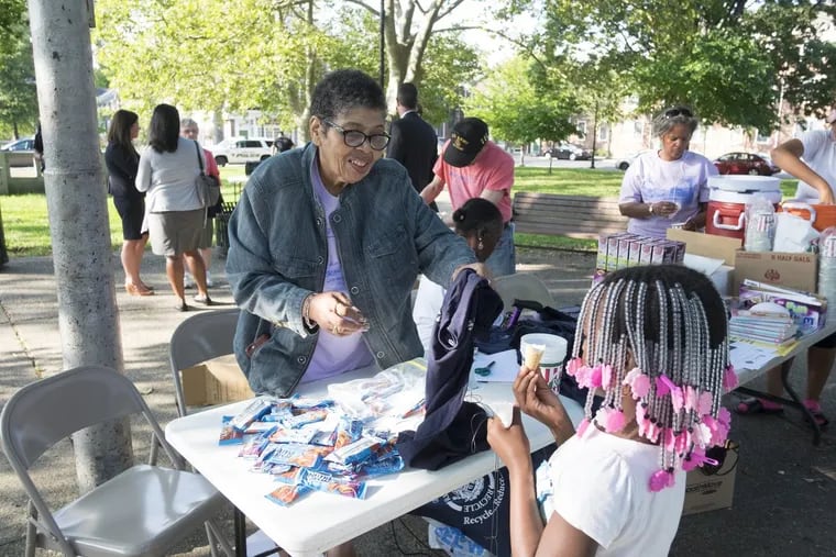 Dorothy Burley, helping at an event in 2016, had been co-chair of the Fairview Neighborhood Association.