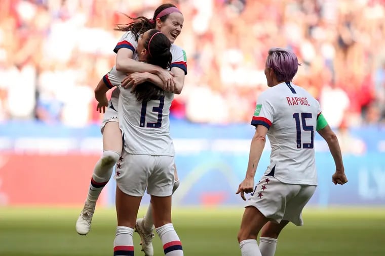 Rose Lavelle celebrates her goal with Alex Morgan and Megan Rapinoe (right) during Sunday's final in Lyon.