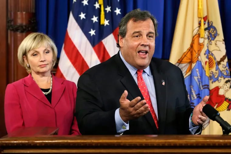 Happier times: New Jersey Lt. Gov. Kim Guadagno stands next to Gov. Chris Christie during a press conference in 2013.