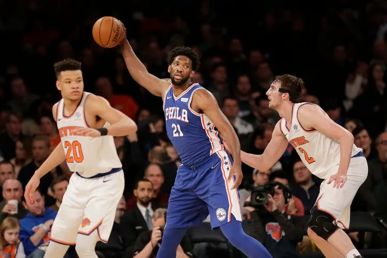 Joel Embiid looks for help during the second half of the Sixers' win over the Knicks on Sunday.