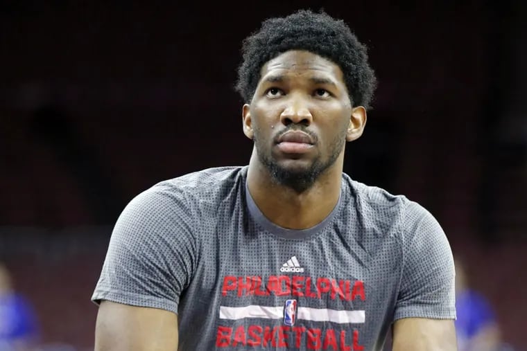 Joel Embiid, a positive presence in the locker room, is working hard to get back on the court next season.