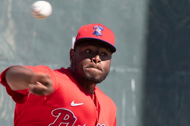 Hector Neris throws during spring training.