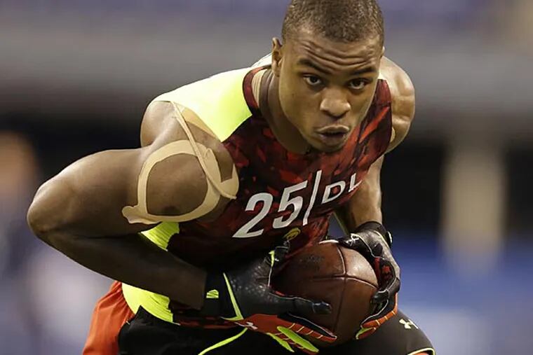 Oregon defensive lineman Dion Jordan runs a drill at the NFL football scouting combine in Indianapolis, Monday, Feb. 25, 2013. (Michael Conroy/AP)