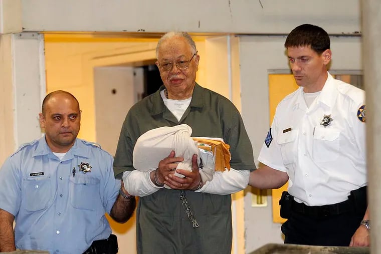 Dr. Kermit Gosnell gets escorted to a van leaving the Criminal Justice Center after getting convicted on three counts of first degree murder on Monday, May 13, 2013.