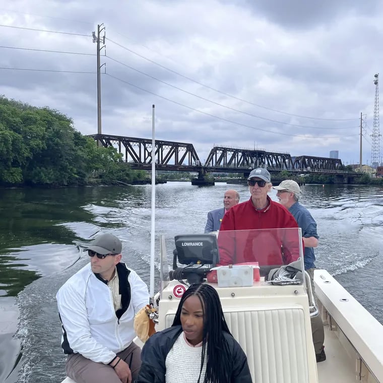 Kianna Bingham of Councimember Jamie Gauthier's office (front); Nathan Boon, of the William Penn Foundation (left front); Dave Corddry at the helm; Philadelphia Councilmember Mark Squilla (rear left); and, Nick Pagon of Riverways Collaborative (rear, right) on boat tour of the Schuylkill.