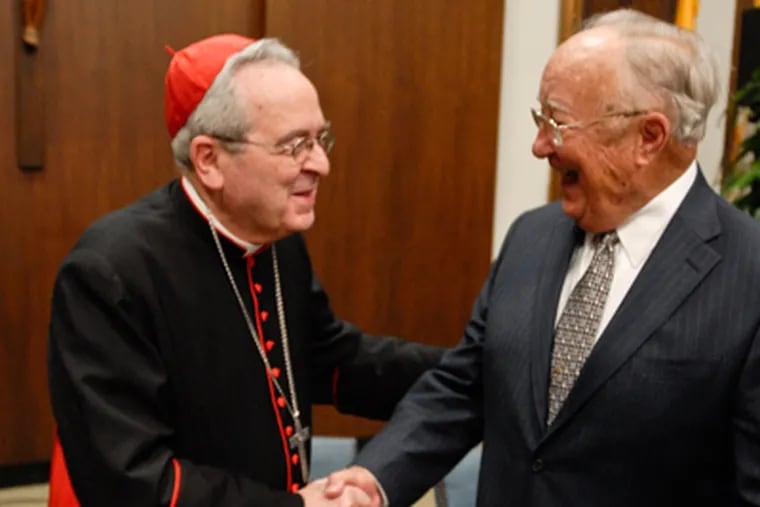 Cardinal Rigali shakes hands with Jack Quindlen, Chairman of the Blue
Ribbon Commisision to chart the future course of Catholic Education in
the Archdiocese. (Ron Tarver / Staff Photographer)