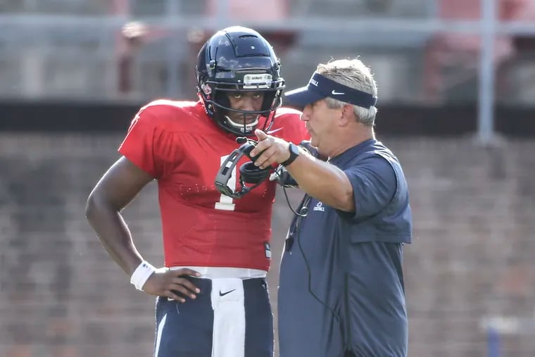 Penn quarterback Ryan Glover talks with head coach Ray Priore during practice at Franklin Field, Thursday, August 30.