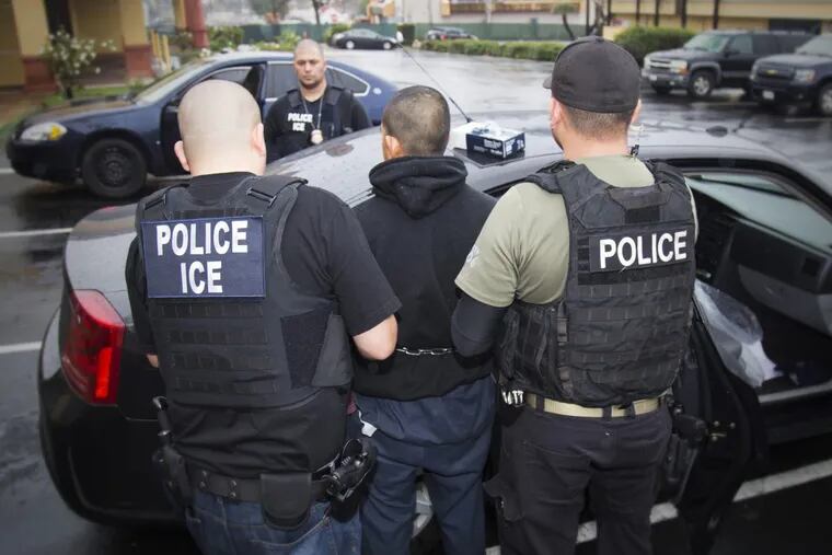 In this Feb. 7, 2017, photo released by U.S. Immigration and Customs Enforcement, foreign nationals are arrested during a targeted enforcement operation conducted by U.S. Immigration and Customs Enforcement (ICE) aimed at immigration fugitives, re-entrants and at-large criminal aliens in Los Angeles.
