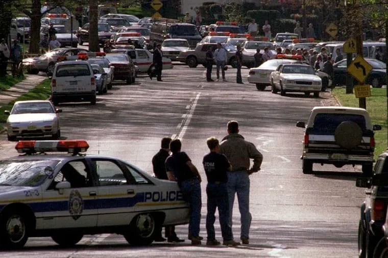 Police near the shooting scene in Haddon Heights in 1995, where two officers - Camden County investigator John McLaughlin and Heights patrolman John Norcross, were gunned down.