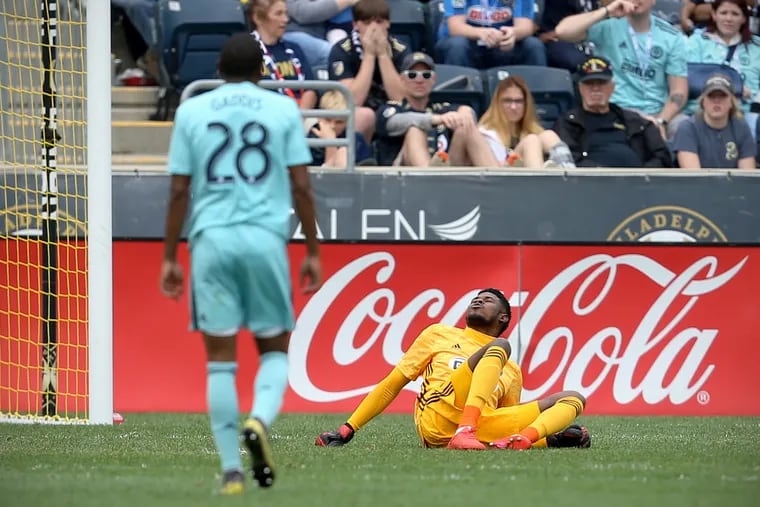 Philadelphia Union goalkeeper Andre Blake lies on the ground after suffering a groin injury in the second half of a 3-0 win over the Montreal Impact at Talen Energy Stadium.