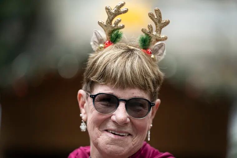 Joyce Banner of Ridley,, Pa., smiles while wearing her reindeer headband on Monday during a shopping day at Dilworth Park in Philadelphia.