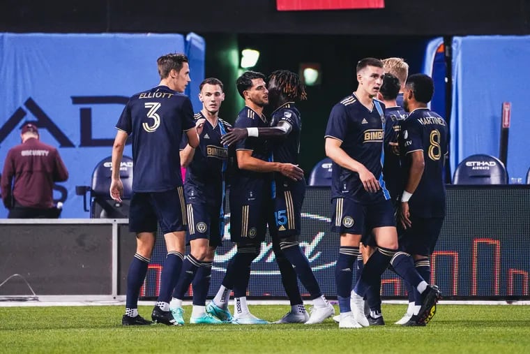 Julián Carranza (center) celebrates with teammates after scoring one of his goals in the Union’s win at NYCFC on Saturday.