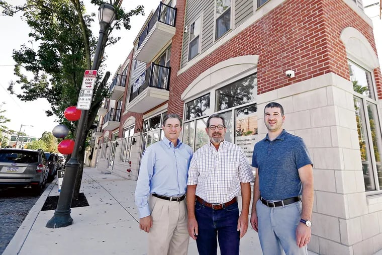 Developers Max Berger (left), Bob Elfant (center), and Jared Pontz (right), in front of the Westview. The complex has 5,000 square feet of retail space and 28 apartments, 17 of which are leased.