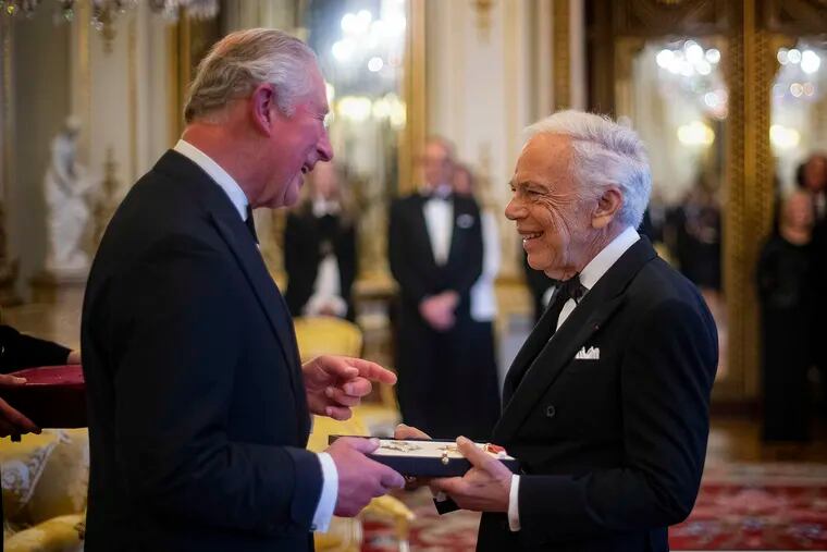 The Prince of Wales presents designer Ralph Lauren with his honorary KBE (Knight Commander of the Order of the British Empire) for Services to Fashion in a private ceremony at Buckingham Palace Wednesday June 19, 2019. (Victoria Jones/PA via AP)