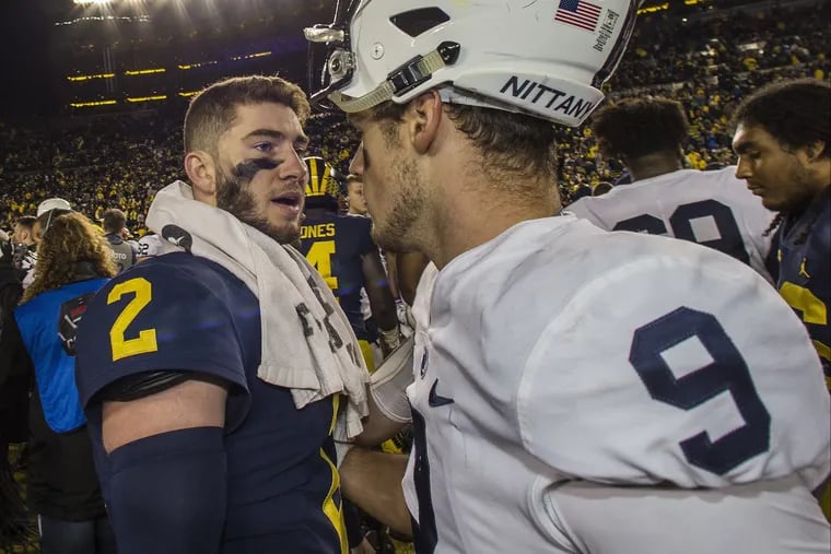 Michigan quarterback Shea Patterson and Trace McSorley after Penn State's 42-7 loss on Saturday.