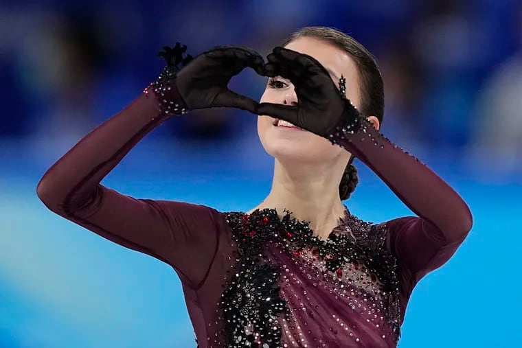 Anna Shcherbakova, of the Russian Olympic Committee, gestures after competing in the women's free skate program during the figure skating competition at the 2022 Winter Olympics.