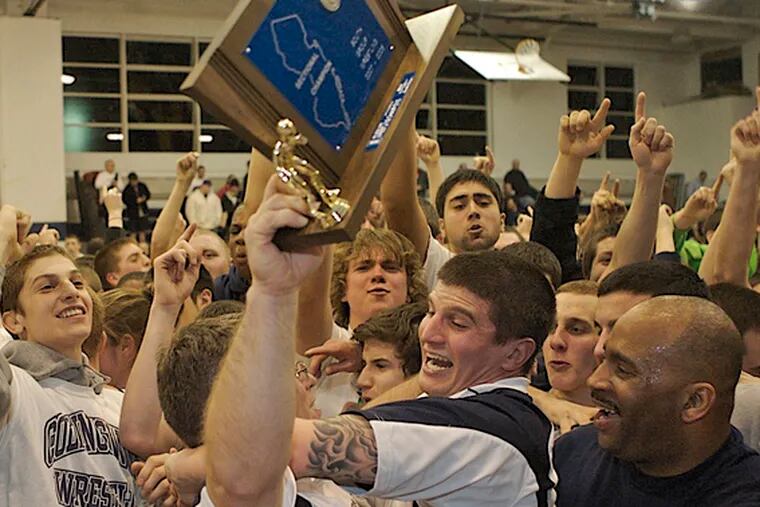 Wrestlers, coaches and fans at Collingswood celebrate a rare victory last February over Paulsboro, the most-formidable name in South Jersey wrestling.