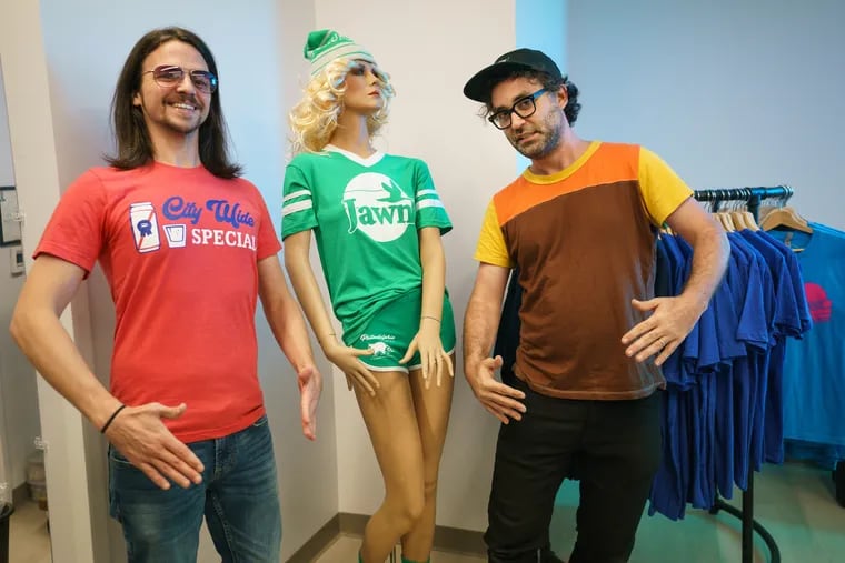South Fellini Co-owners Johnny Zito, left, and Tony Trov, right, pose with the Mannequin, center, from the 1987 film "Mannequin," which was filmed in Philadelphia (at Wanamaker's, now Macy's), in their store at the new Fashion District during a media preview of the new shopping and entertainment area located on Market Street near 9th Street, in Philadelphia, September 17, 2019.