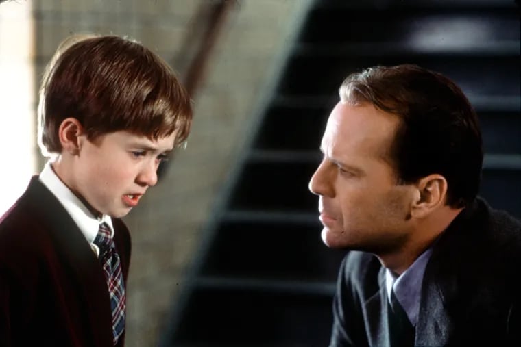Eight-year-old Cole Sear (Haley Joel Osment, left) is haunted by a dark secret. When child psychologist Dr. Malcolm Crowe (Bruce Willis, right) eventually realizes the extraordinary truth about Cole, the consequences for client and therapist are a jolt that awakens them to something astonishing--and unexplainable.