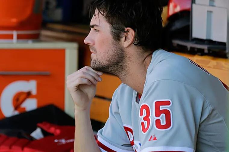 Philadelphia Phillies starting pitcher Cole Hamels pauses in the dugout between innings. (Alex Brandon/AP)