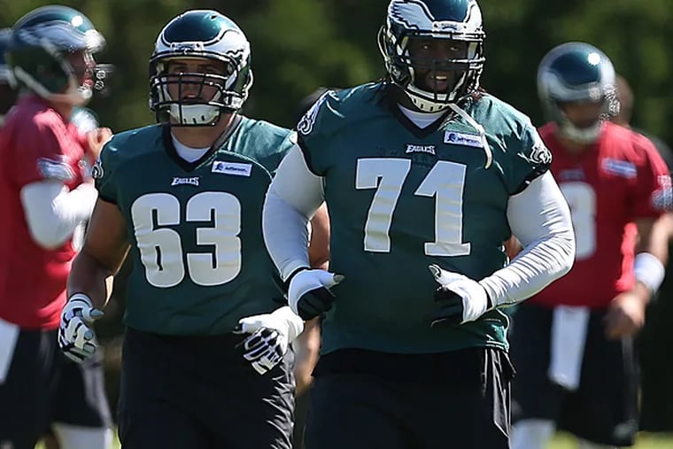Eagles offensive linemen David Molk (left) and Jason Peters (right). (David Maialetti/Staff Photographer)